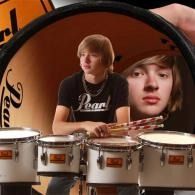 Two boys composited behind a row of drums, one in a black Pearl shirt, with a magnified face in the foreground