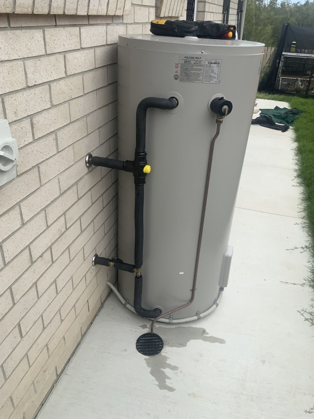 Row of Metal Pipes With Red Valves on Them — Bay City Plumbing in Eli Waters, QLD
