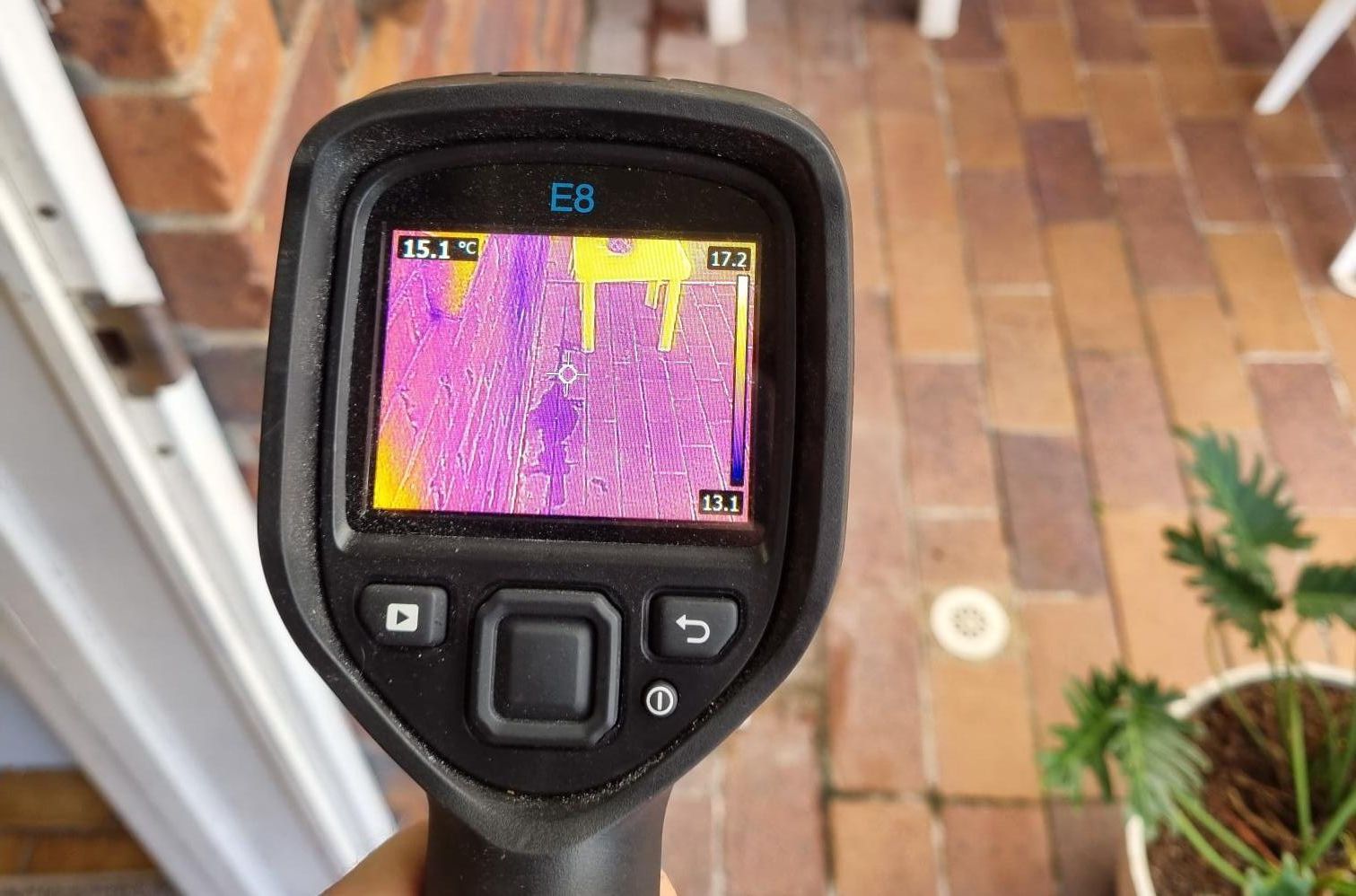 A Person Is Holding A Thermal Camera — Bay City Plumbing in Sunshine Acres, QLD