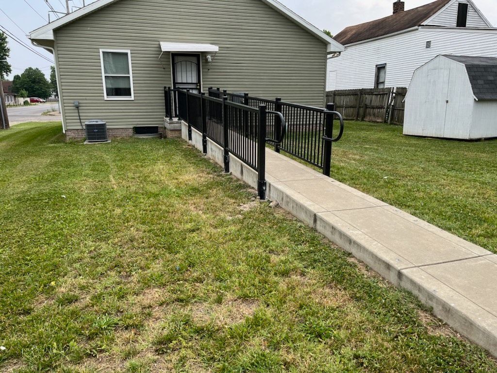 There is a ramp leading to the front of the house.