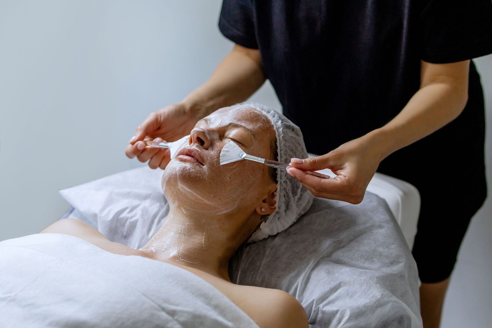 A Woman is Getting a Facial Treatment at a Spa — Organic Beauty by Kessie in Yeppoon, QLD