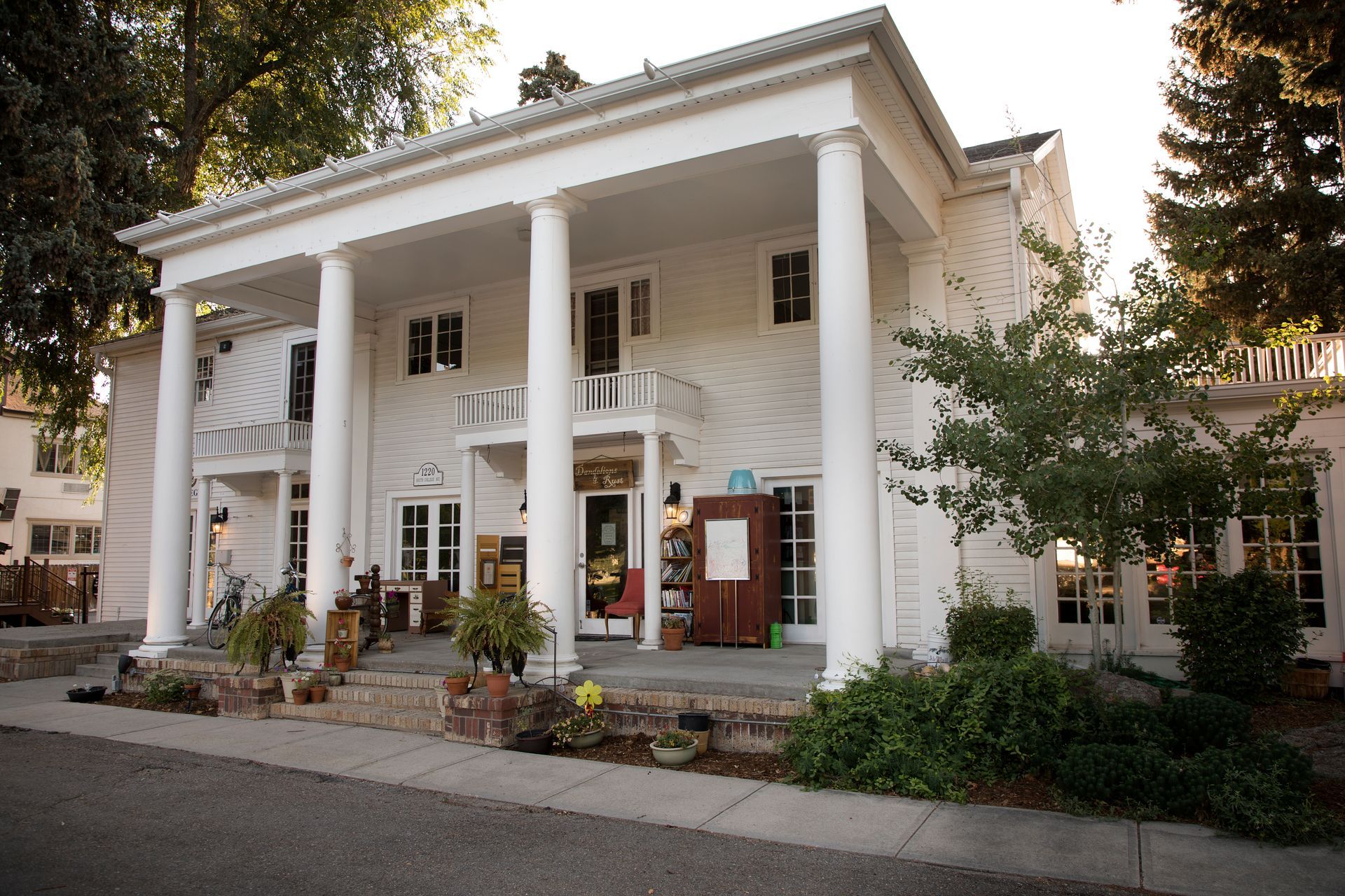 A large white building with columns and a porch