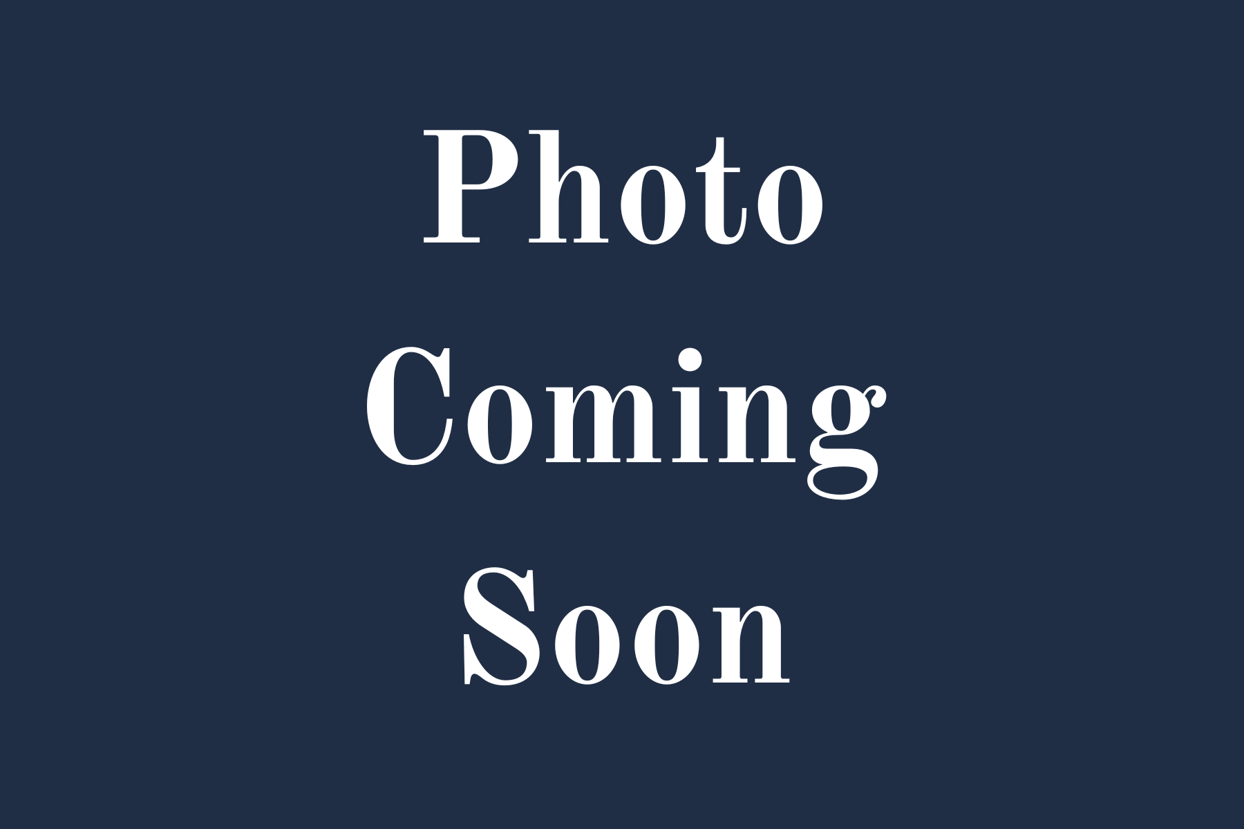 A blue background with white text that says photo coming soon