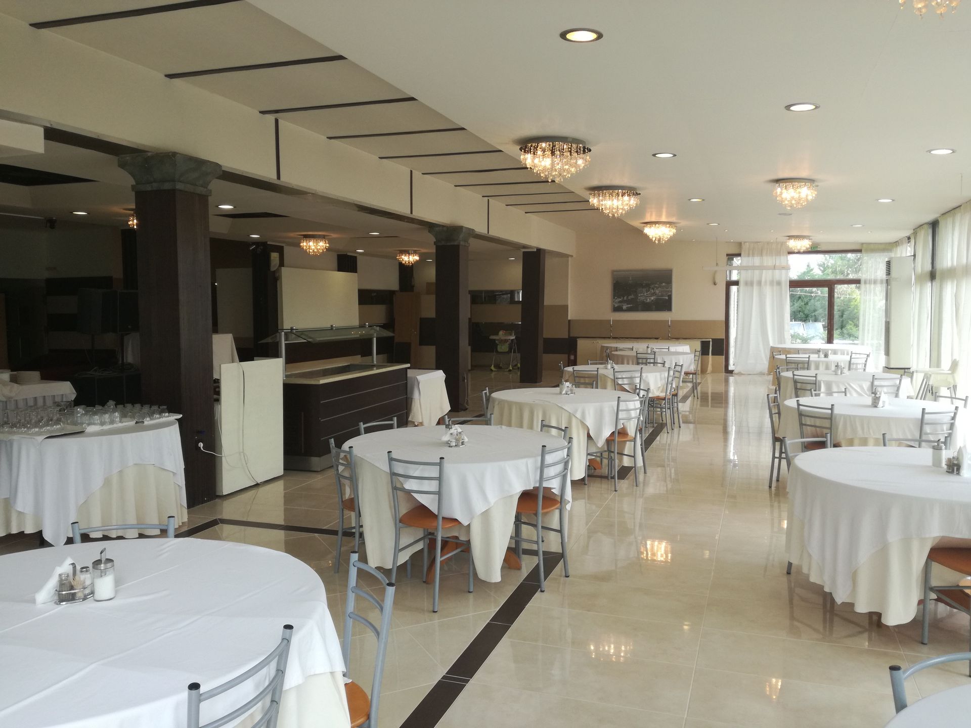 A large room with tables and chairs in it