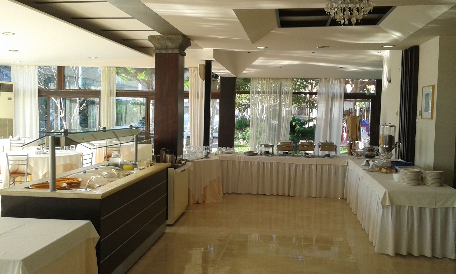 A large room with tables and buffets in it