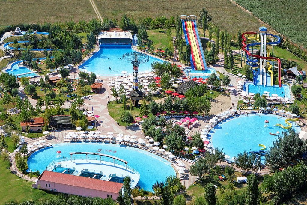 An aerial view of a water park with a water slide