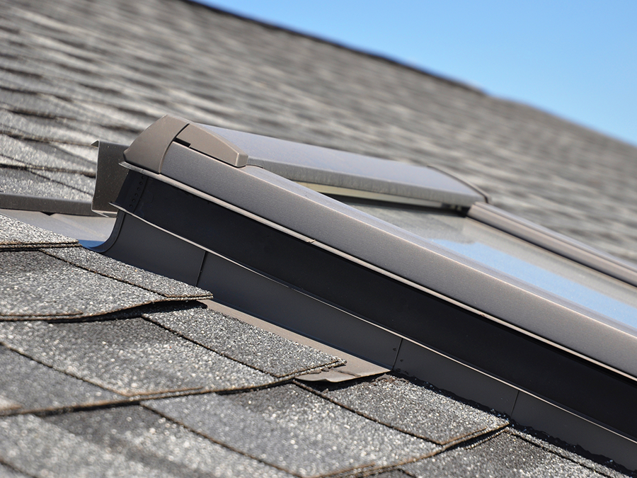 A skylight is sitting on top of a roof