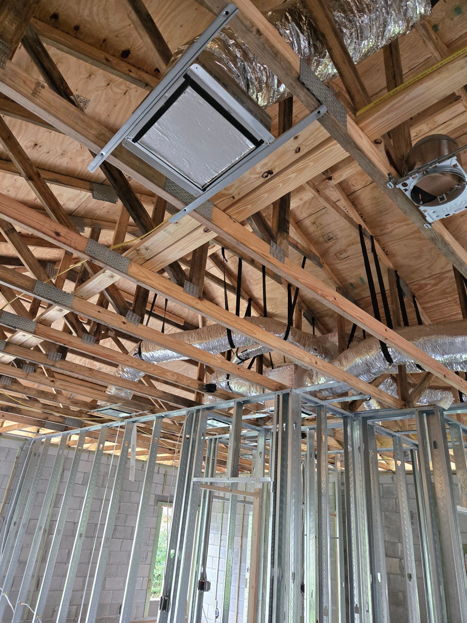 A picture of the ceiling of a building under construction.
