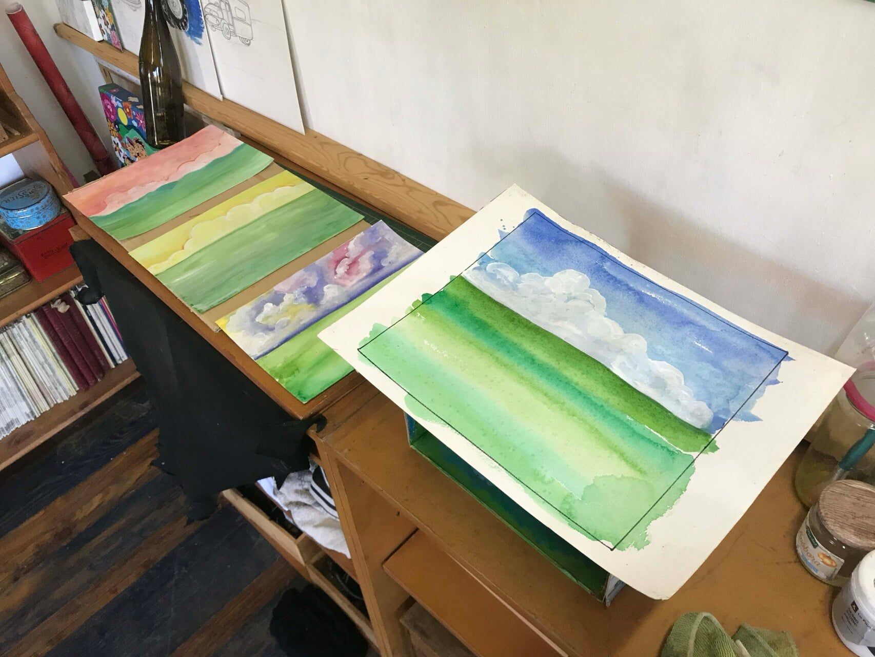 Twee landschapsschilderijen in aquarel.