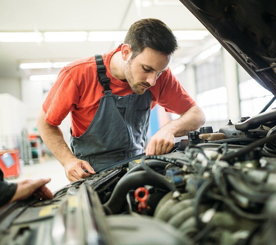 Man Checking Car Engine — Hermiston, OR — Pioneer Transmission Service Inc