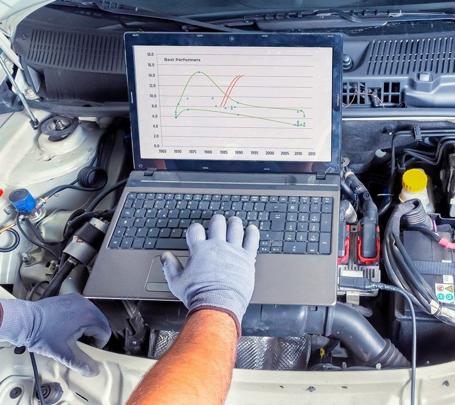 Person Diagnosing Car Status — Hermiston, OR — Pioneer Transmission Service Inc