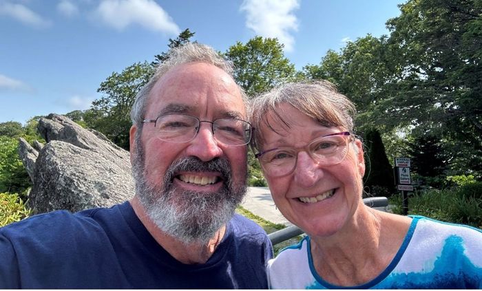 A man and a woman are smiling for a picture.