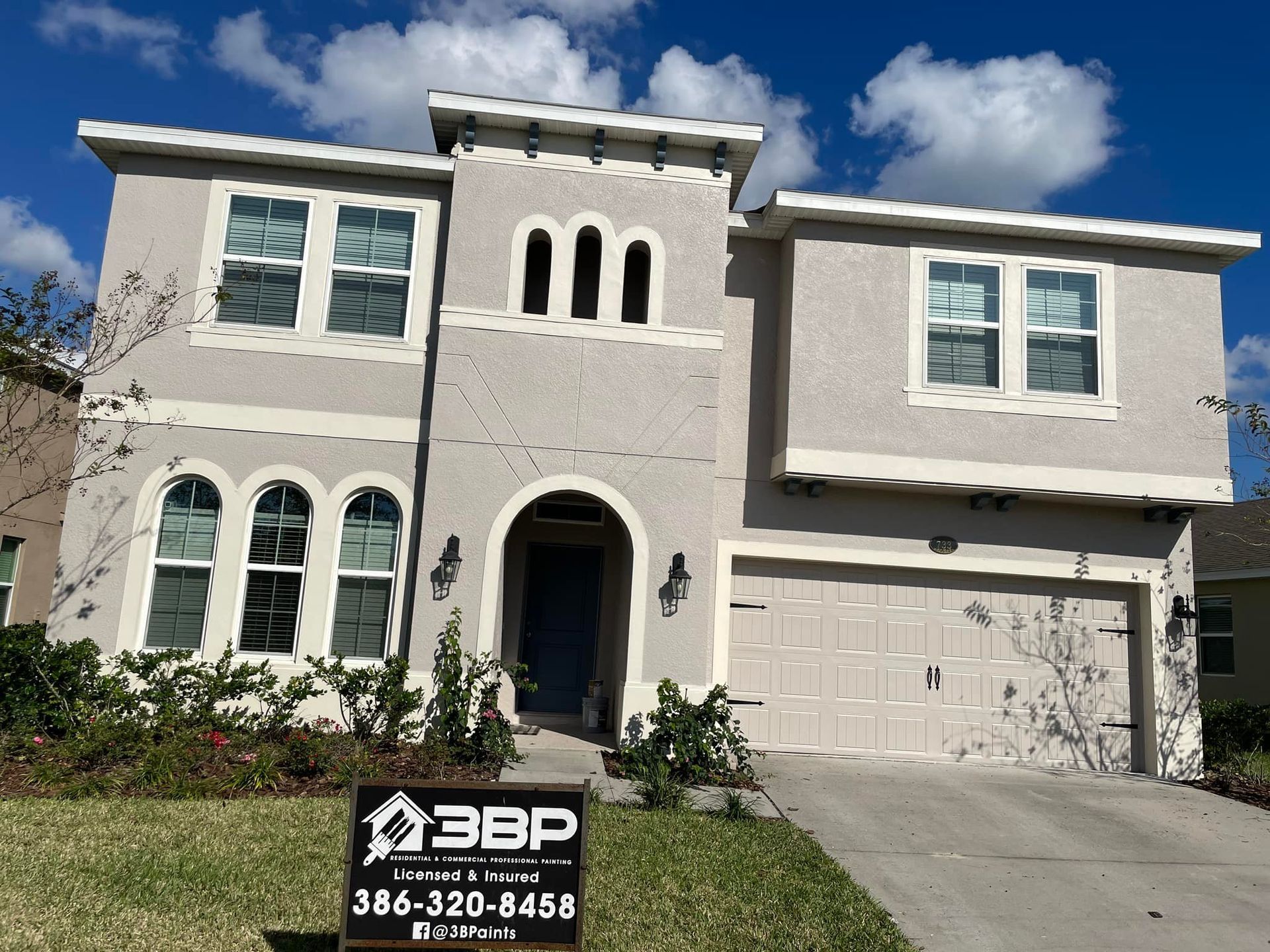 A large house with a 3bp sign in front of it