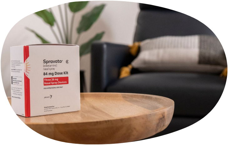 Spravato medicine box on a wooden table in a living room setting