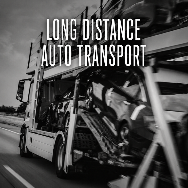 Black-and-white photo of a car carrier truck transporting vehicles with “LONG DISTANCE AUTO TRANSPORT” text.