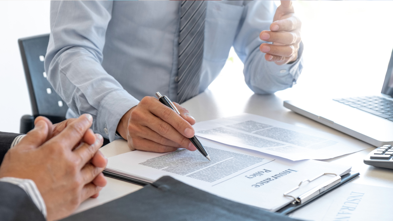 Small business owner reviewing employee health insurance options in El Paso TX