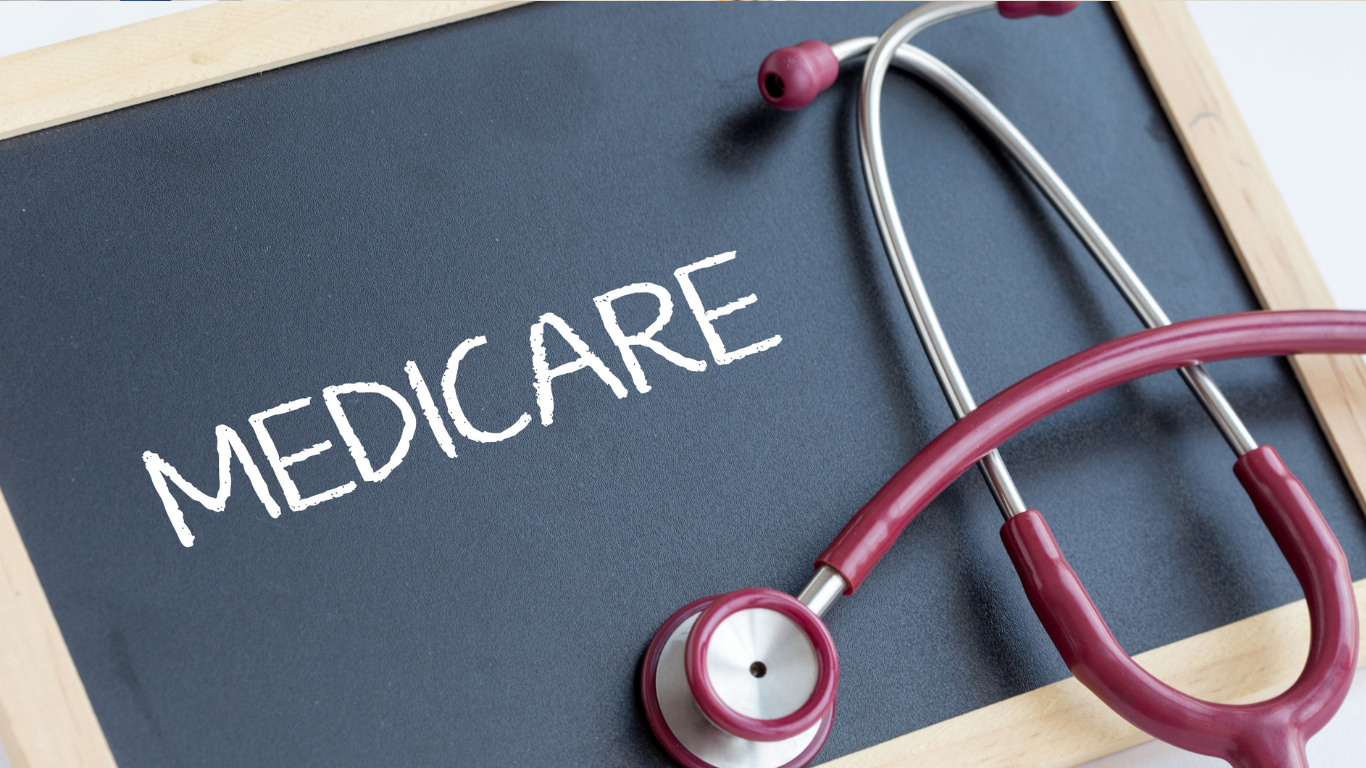 Medicare written on a chalkboard with a stethoscope beside it