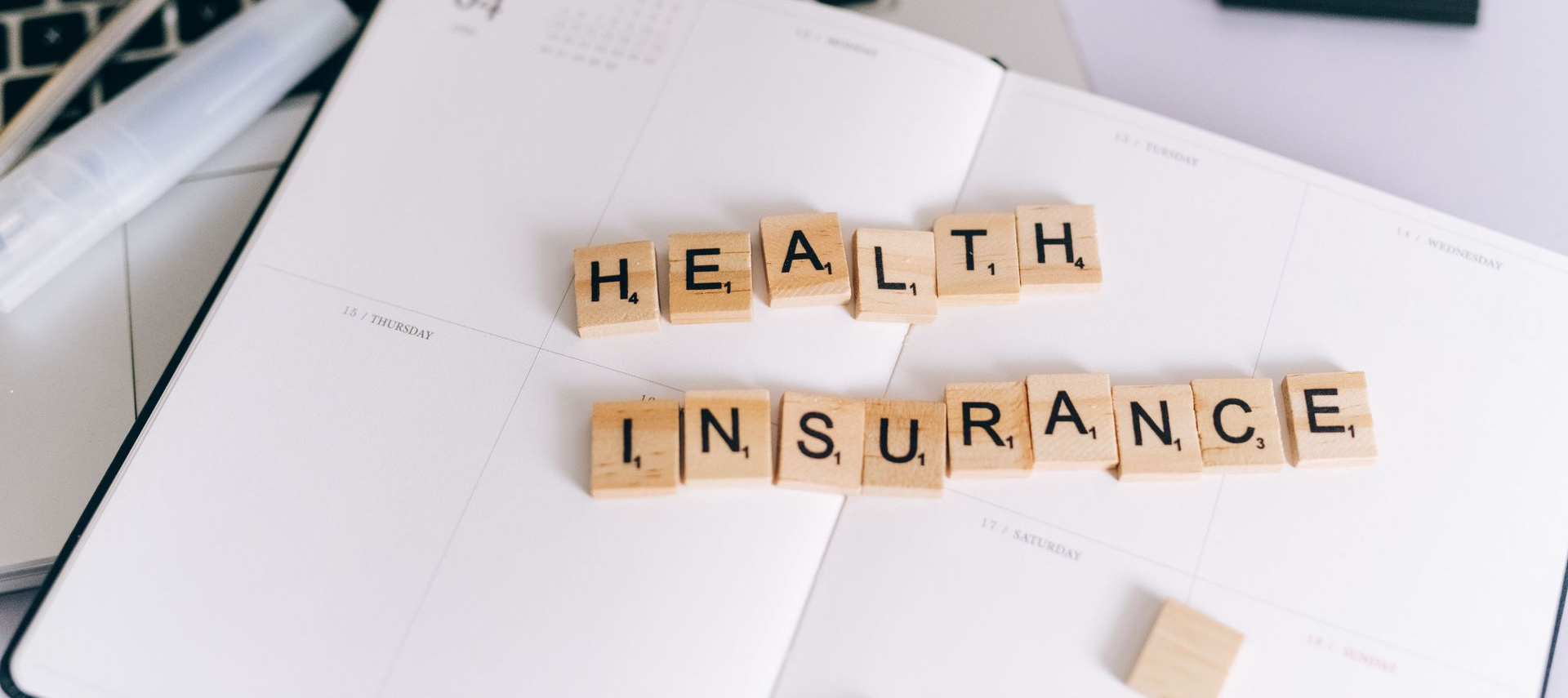 Small business owner comparing group health insurance options in El Paso