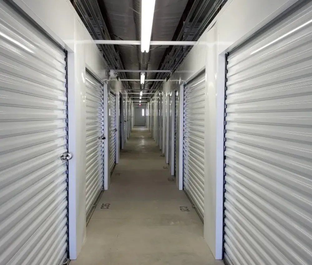 Climate-controlled indoor hallway at Taos Self Storage in El Prado, NM