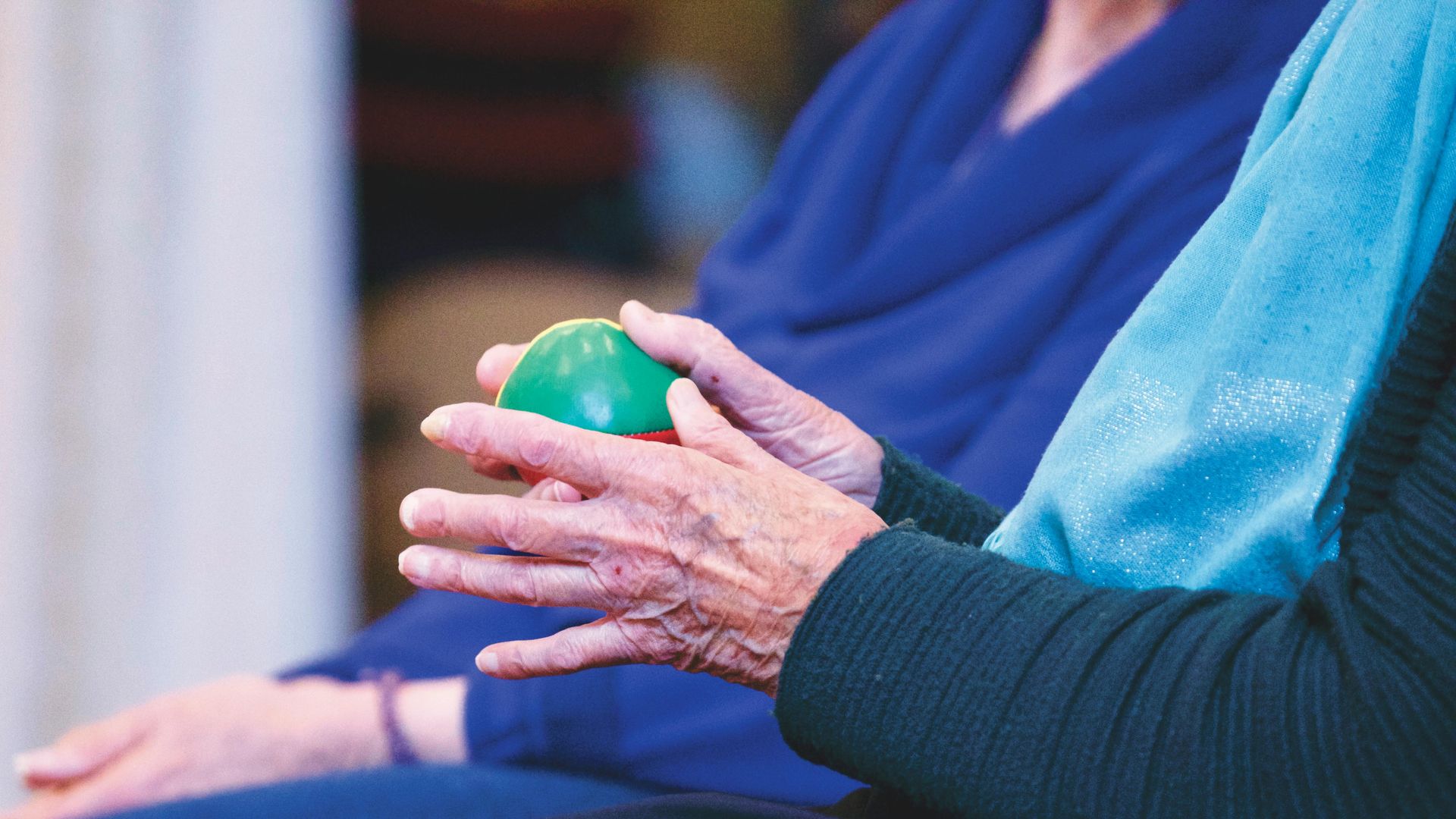 old person holding ball | on site amenities at memory care in ozark mo