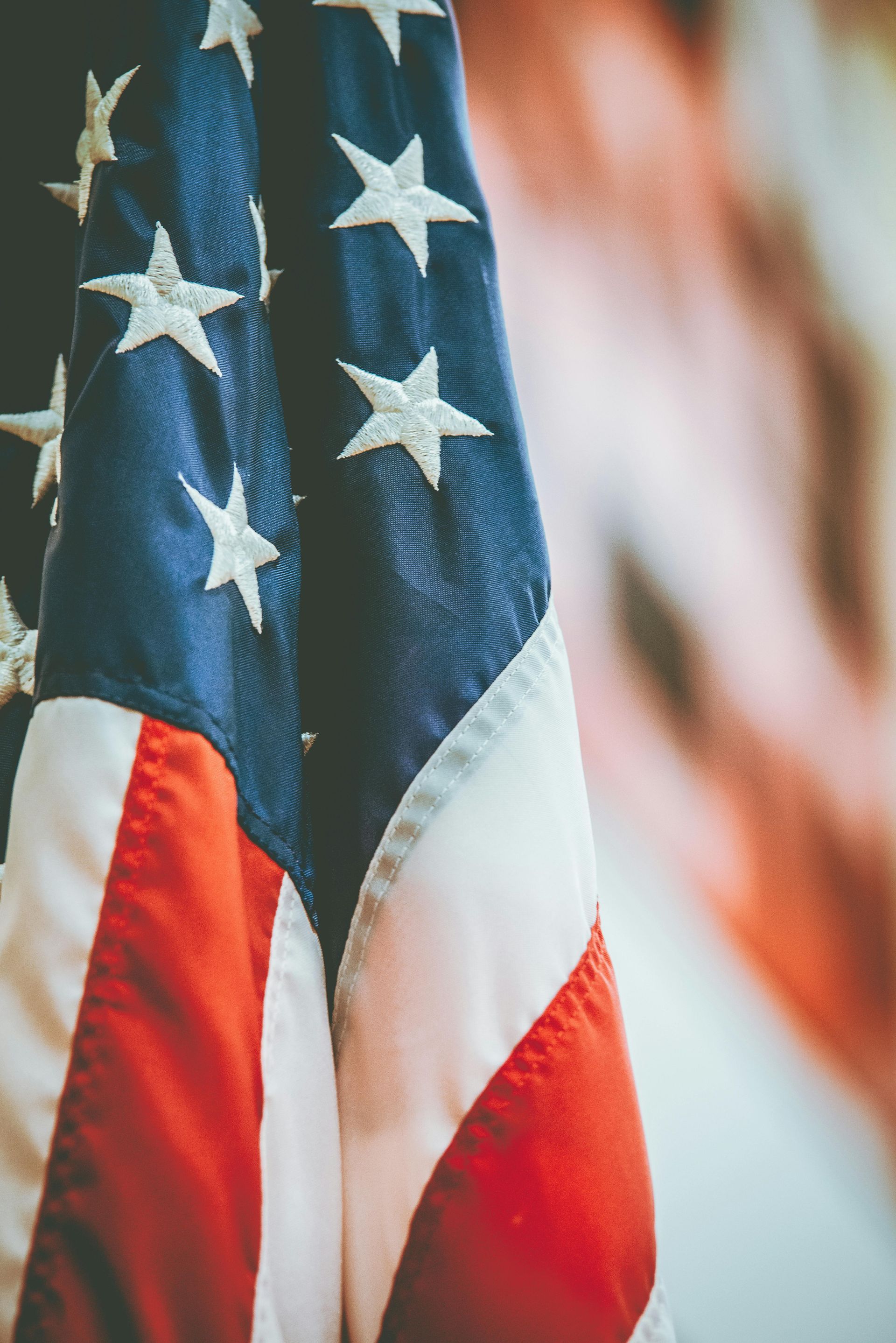 A close up of an american flag with stars on it.