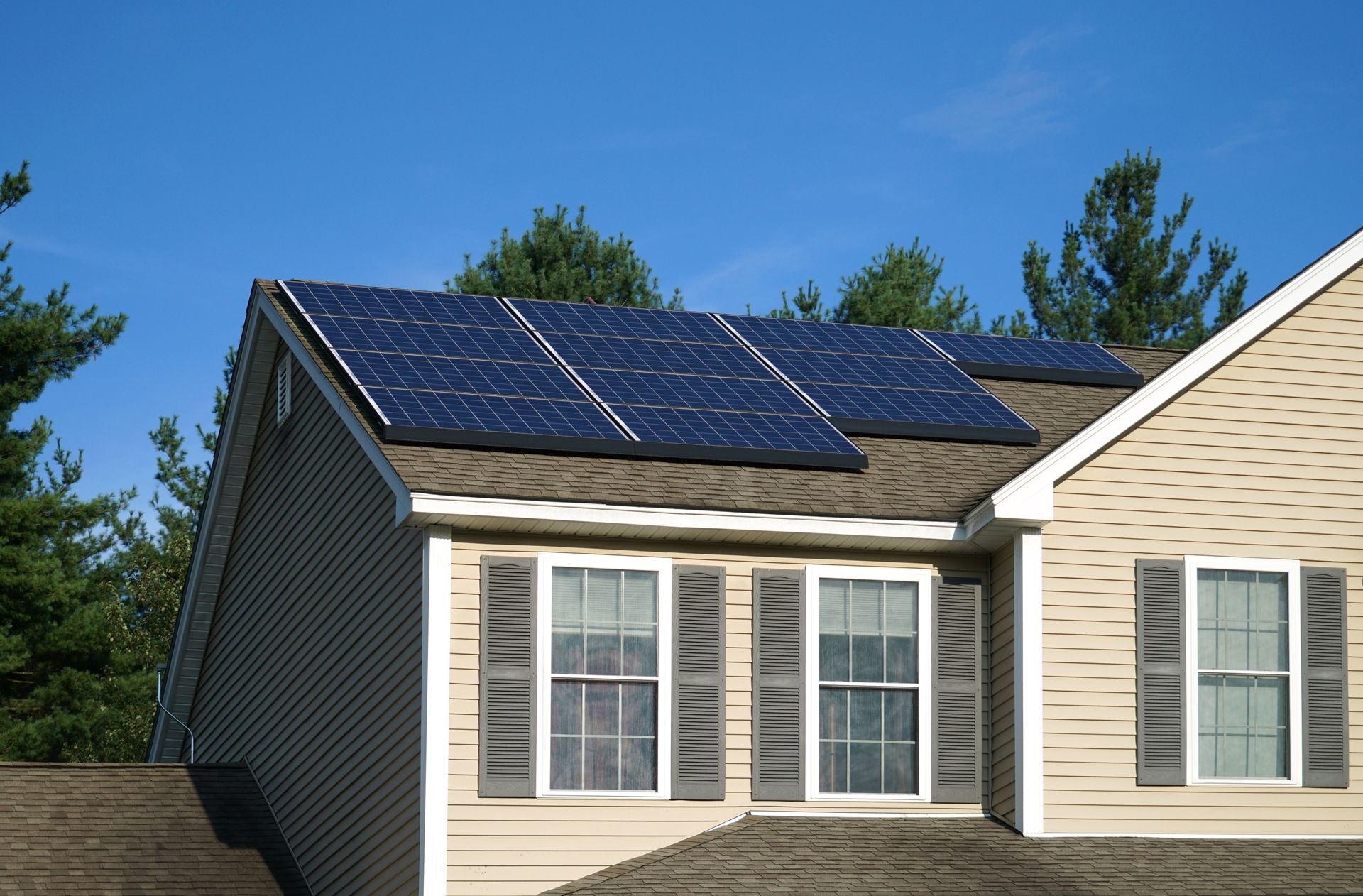 Synergy Electrical Contracting crew installing solar panels on a Connecticut home