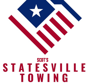 A logo for statesville towing with an american flag on it