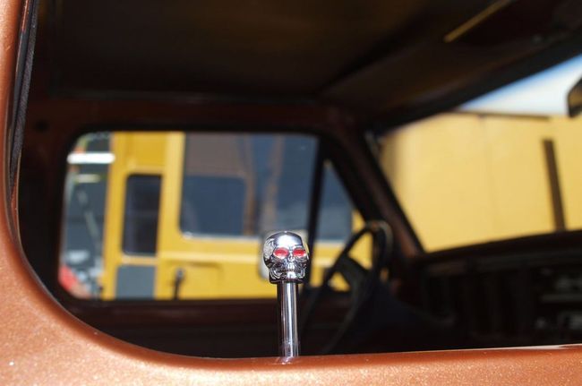 A close up of a steering wheel knob in a car