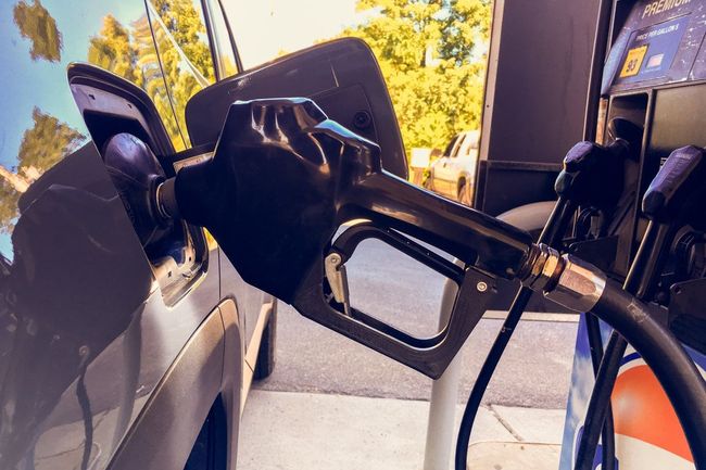 A car is being filled with gas at a gas station.