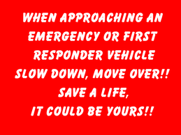 A red sign that says when approaching an emergency or first responder vehicle slow down move over save a life it could be yours