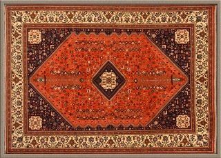 A framed rug with a diamond pattern on it