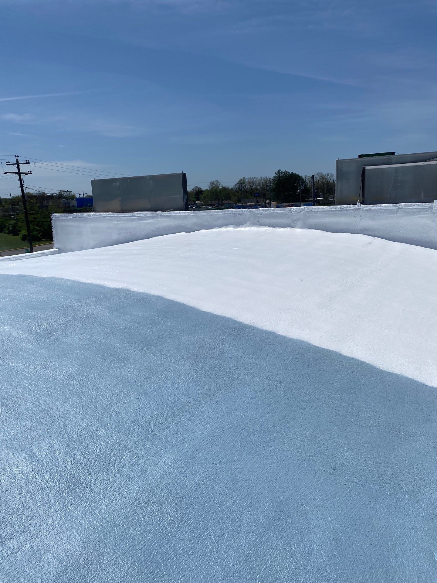 A roof with a lot of white coating on it.