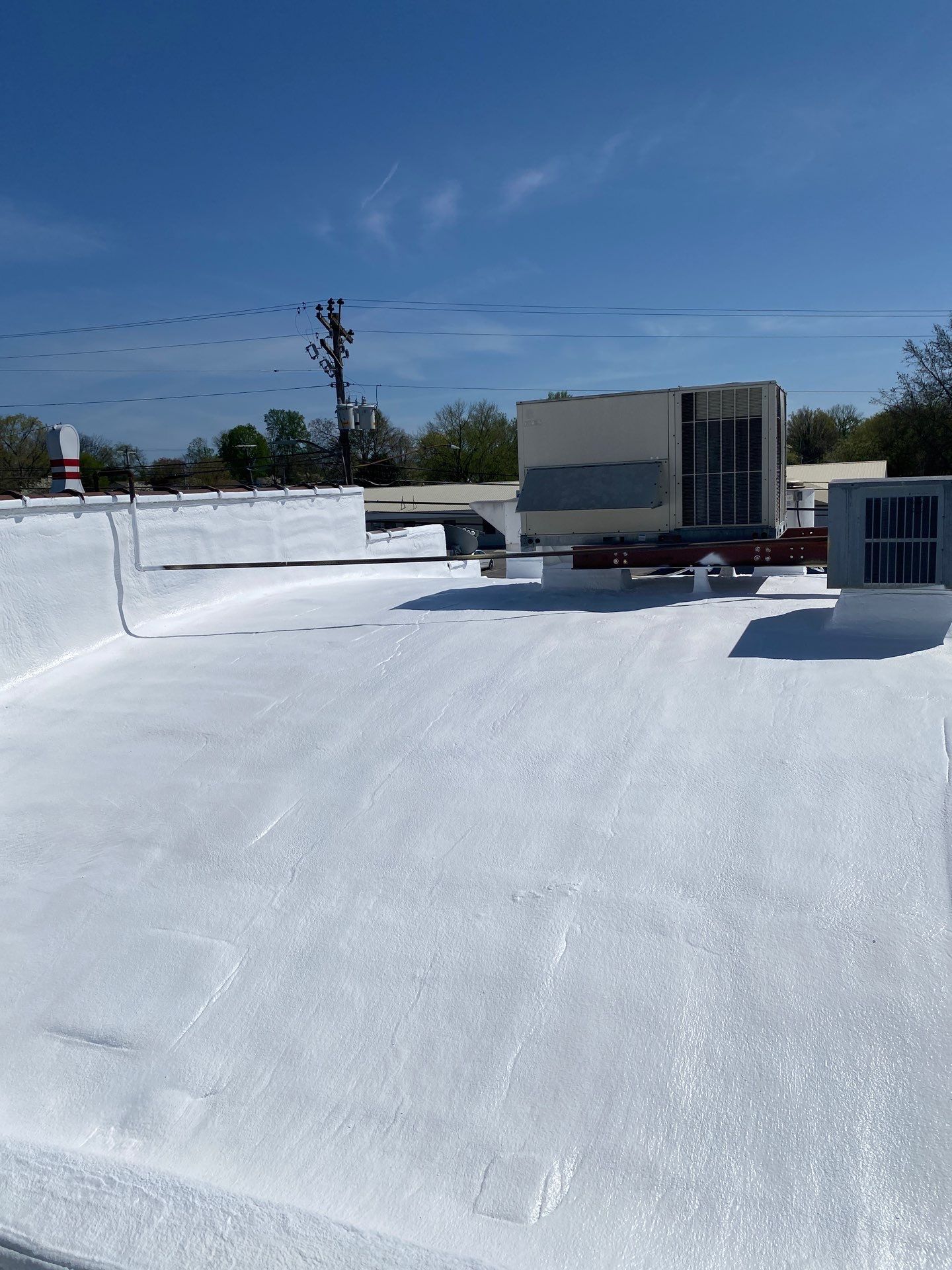 A white roof with a blue sky in the background.