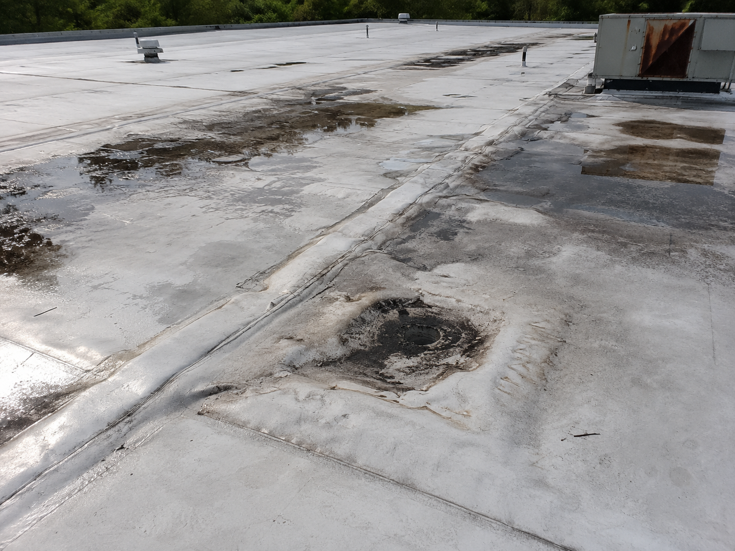 Commercial flat roof inspection for leak prevention in Western Kentucky