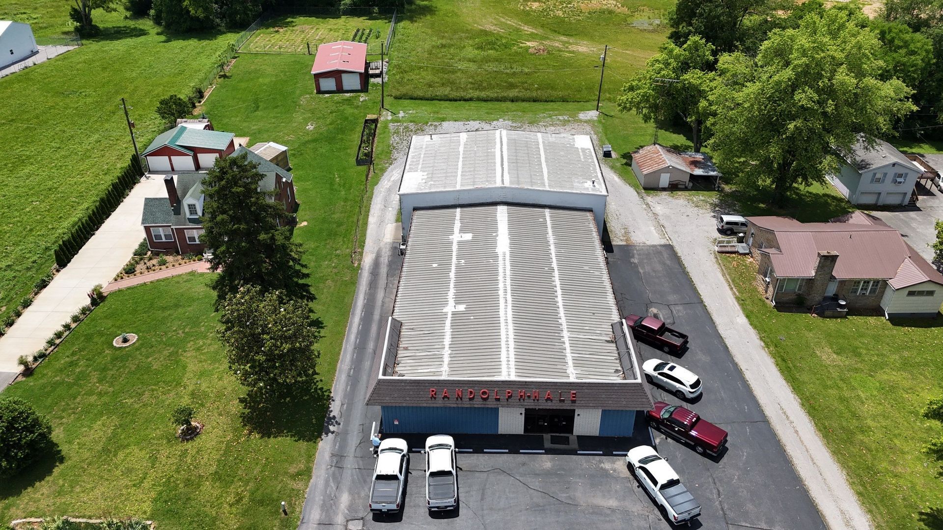 Commercial metal roof before restoration in Madisonville KY with visible seam wear and aging panels