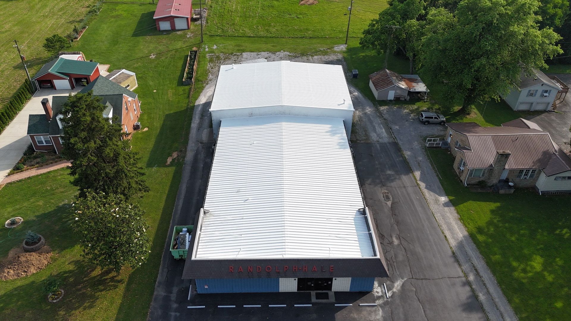 Restored white commercial metal roof in Madisonville KY completed by Premier Roof Solutions
