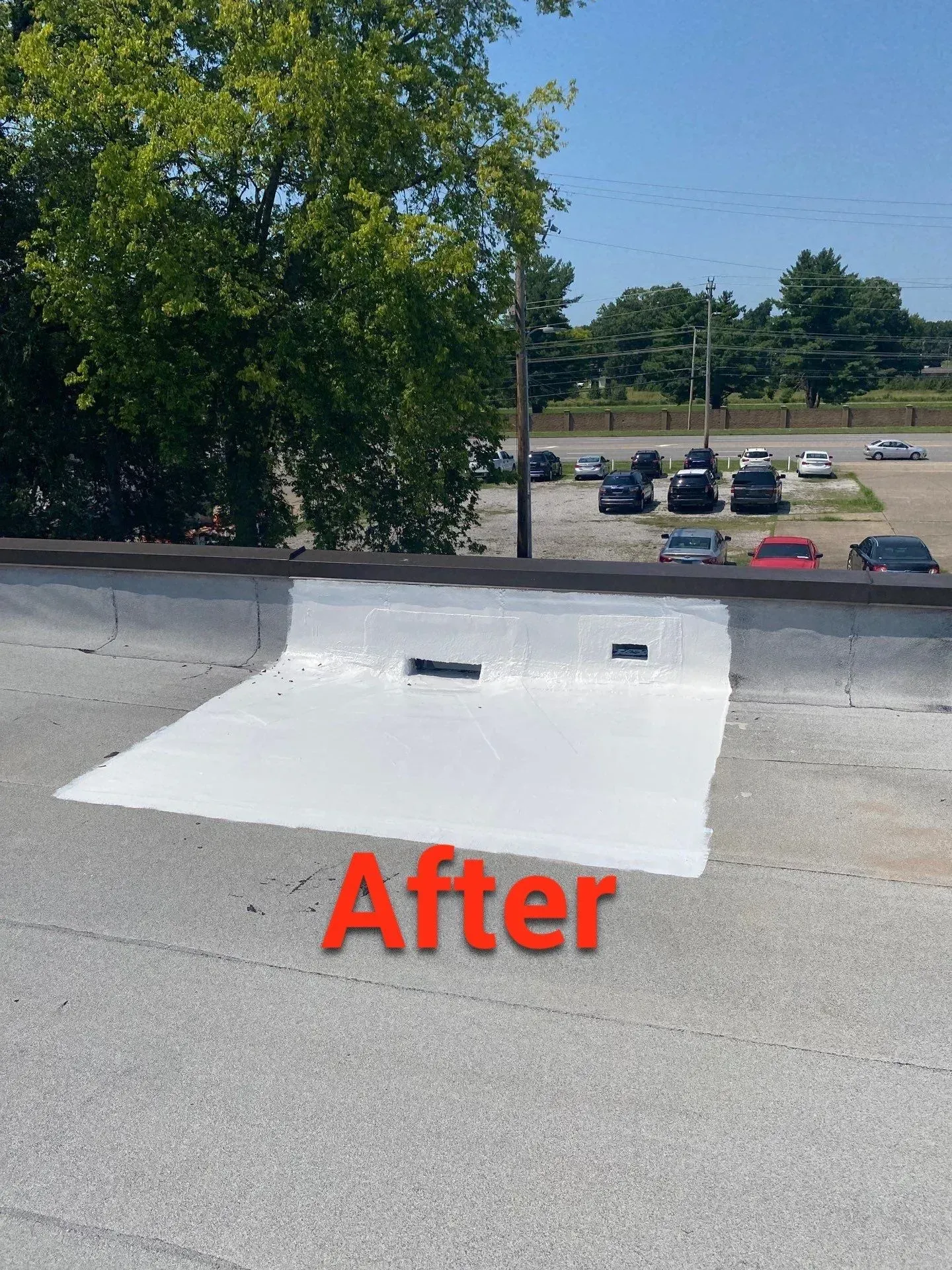 After repair: seamless white fabric-reinforced coating sealing the roof detail and parapet wall in Oak Grove, KY