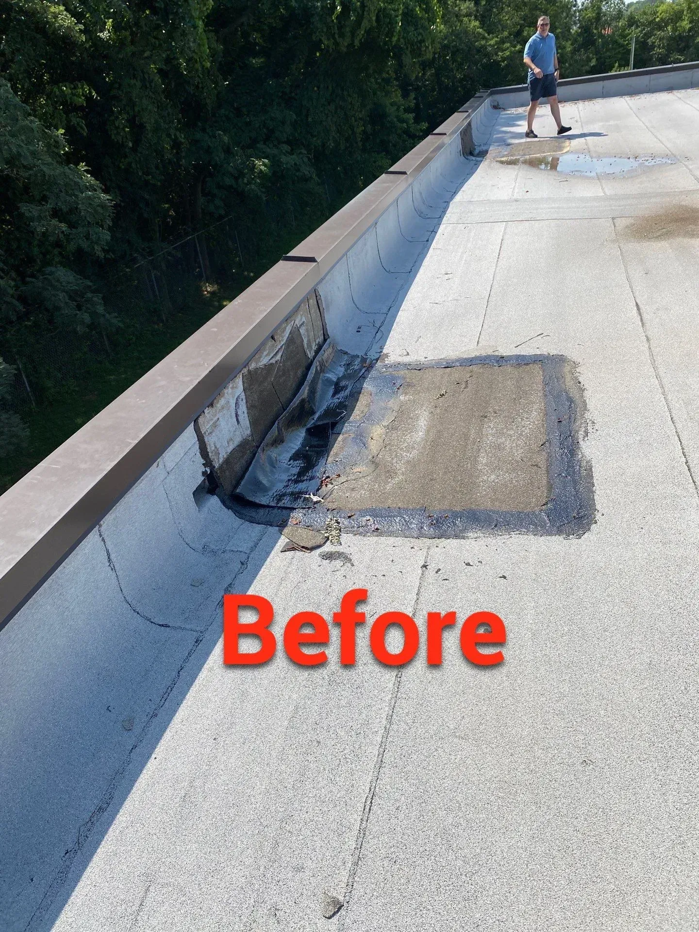 Before repair: failing rubber patch, curling flashing, and ponding water on a commercial flat roof in Oak Grove, KY