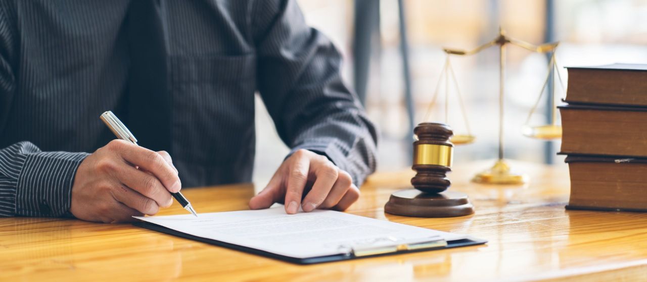a judge or lawyer working on a document