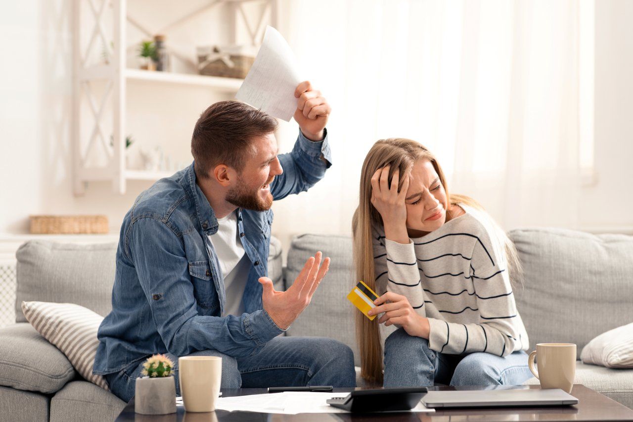 man shouting at his ex wife for spending too much