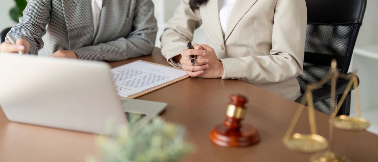 a lawyer or judge talking to a client