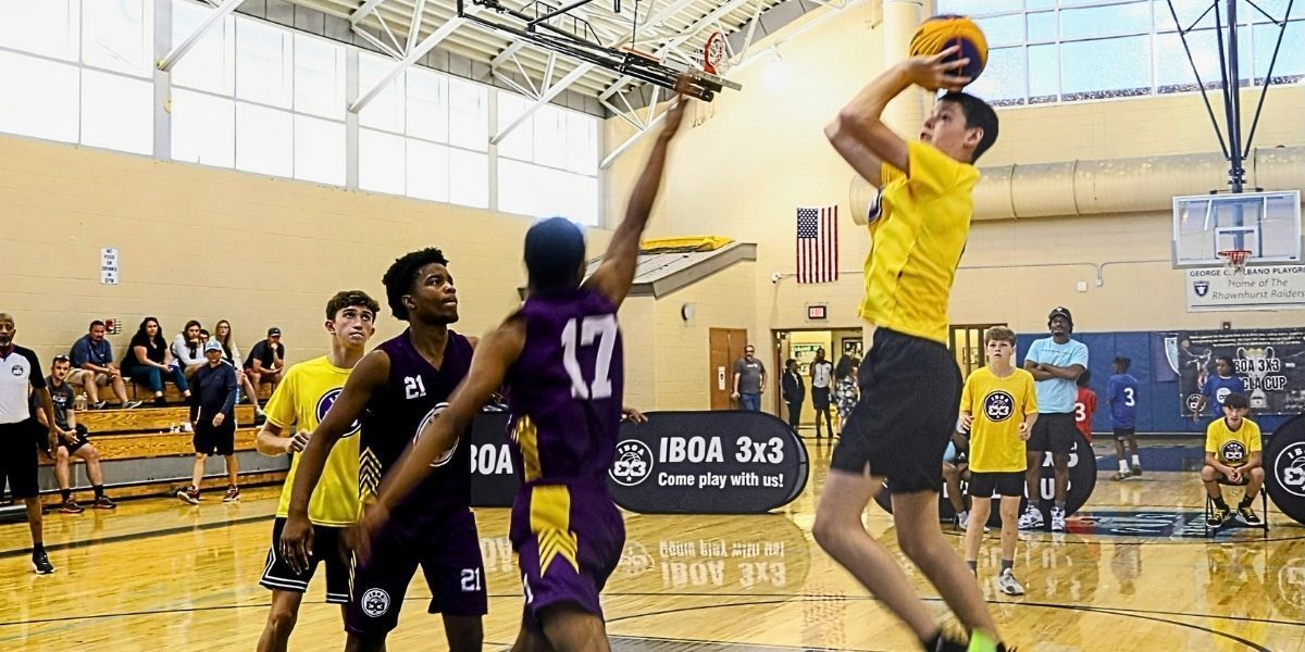 Nick Jandreau shoots over a defender during the 2026 IBOA 3x3 NACLA CUP finals at Pelbano Recreation zcenter.