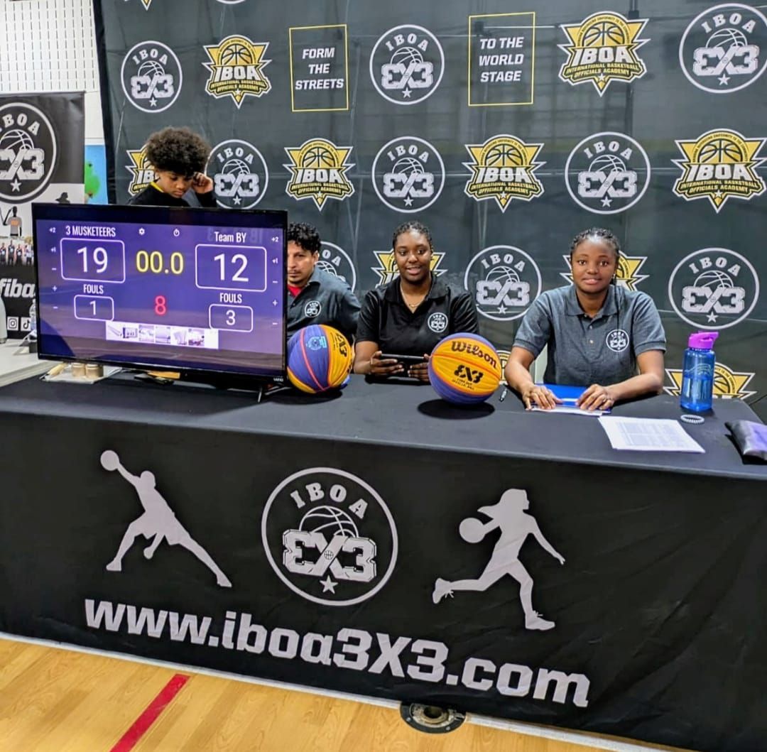 IBOA officials and staff sitting at the tournament scorer's table during the NACLA CUP event.