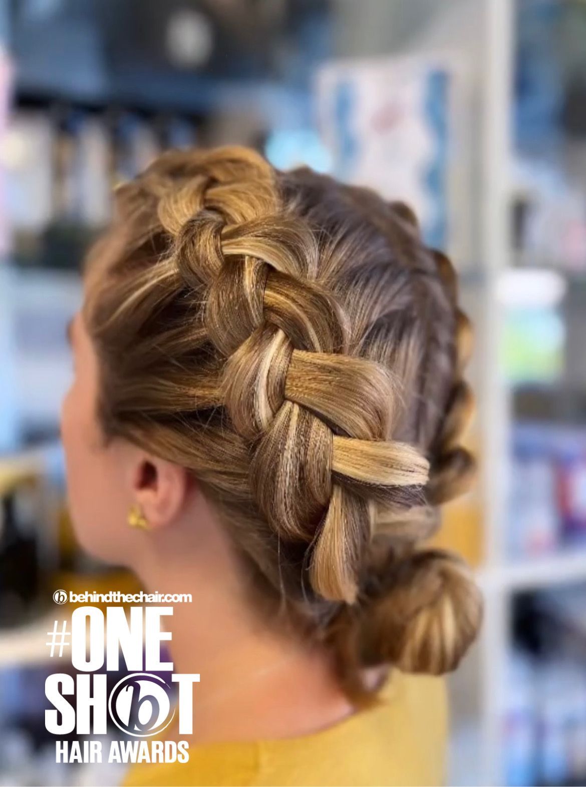 Close-up of dark blonde hair that has been braided in the back.