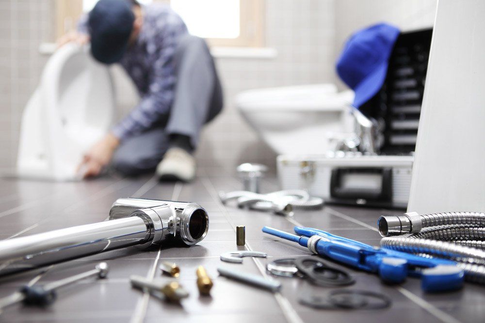 Plumber at Work in a Bathroom - Plumber in East Tamworth, NSW