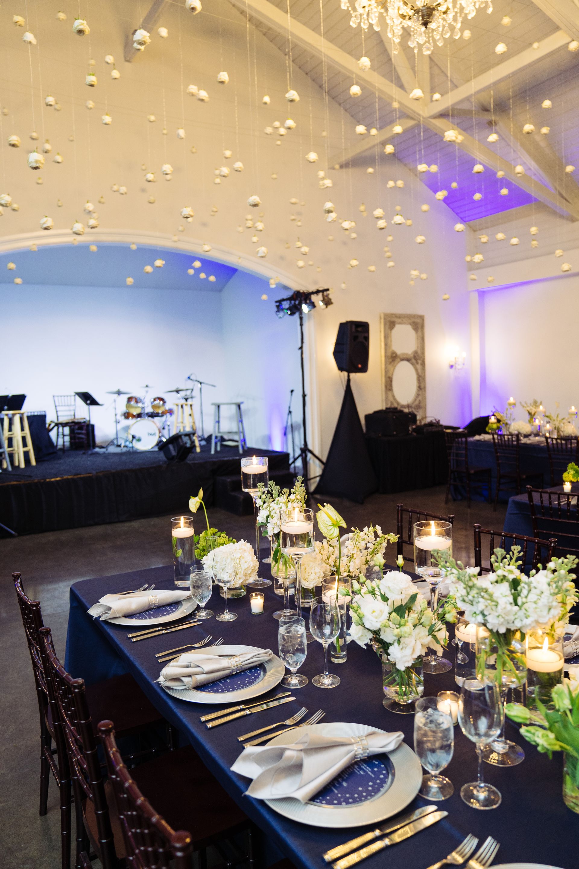 Corporate Event dinner at The Merrimon-Wynne House in Raleigh, NC with long tables and white florals.