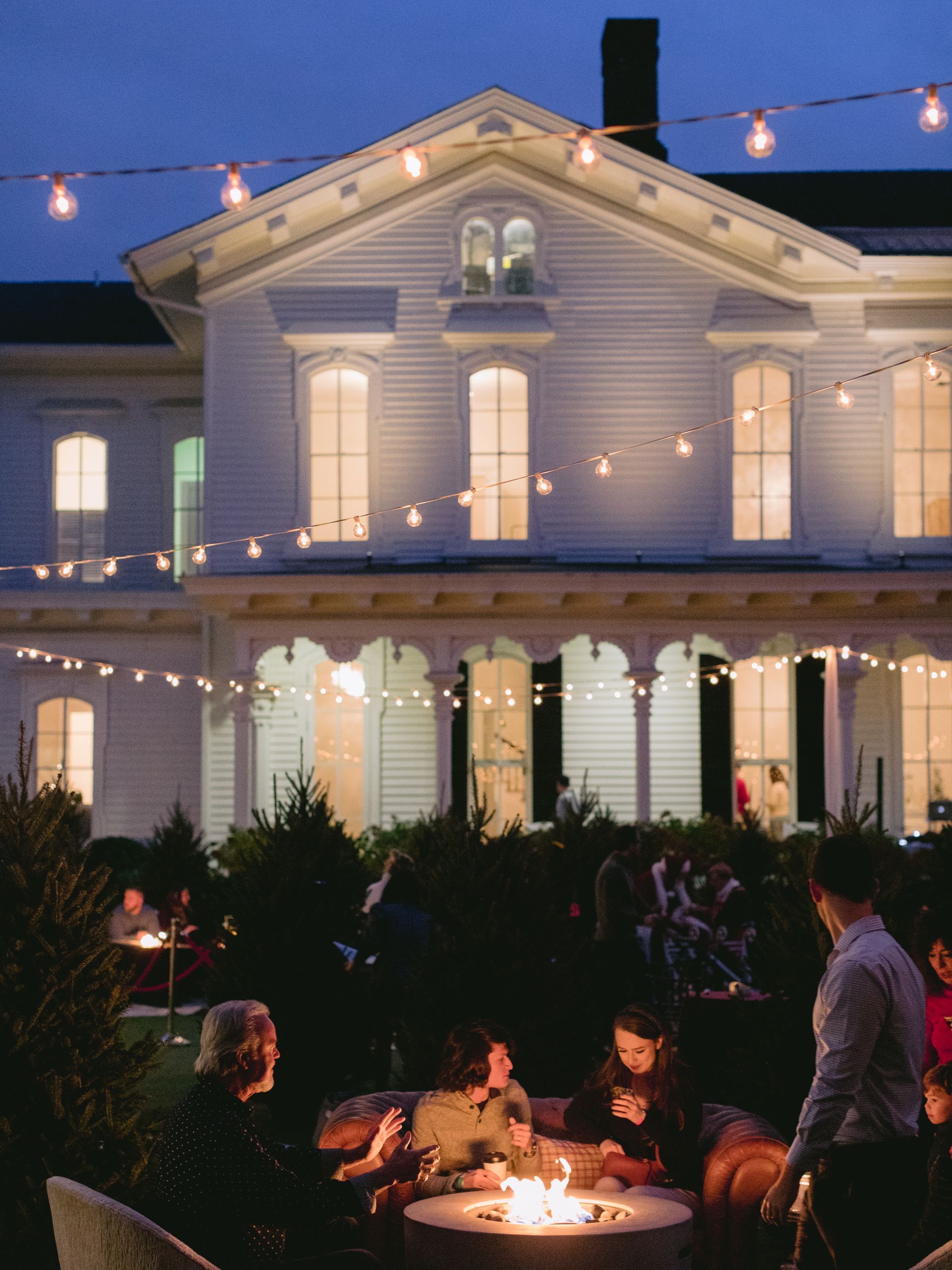 Corporate Event Holiday Party at The Merrimon-Wynne House in Raleigh, NC. Seating area for guets on lawn beside the main house.
