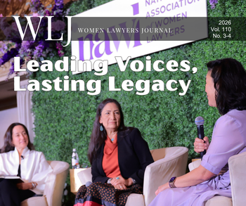 Cropped cover of a magazine with title and photo of women speaking on a stage.