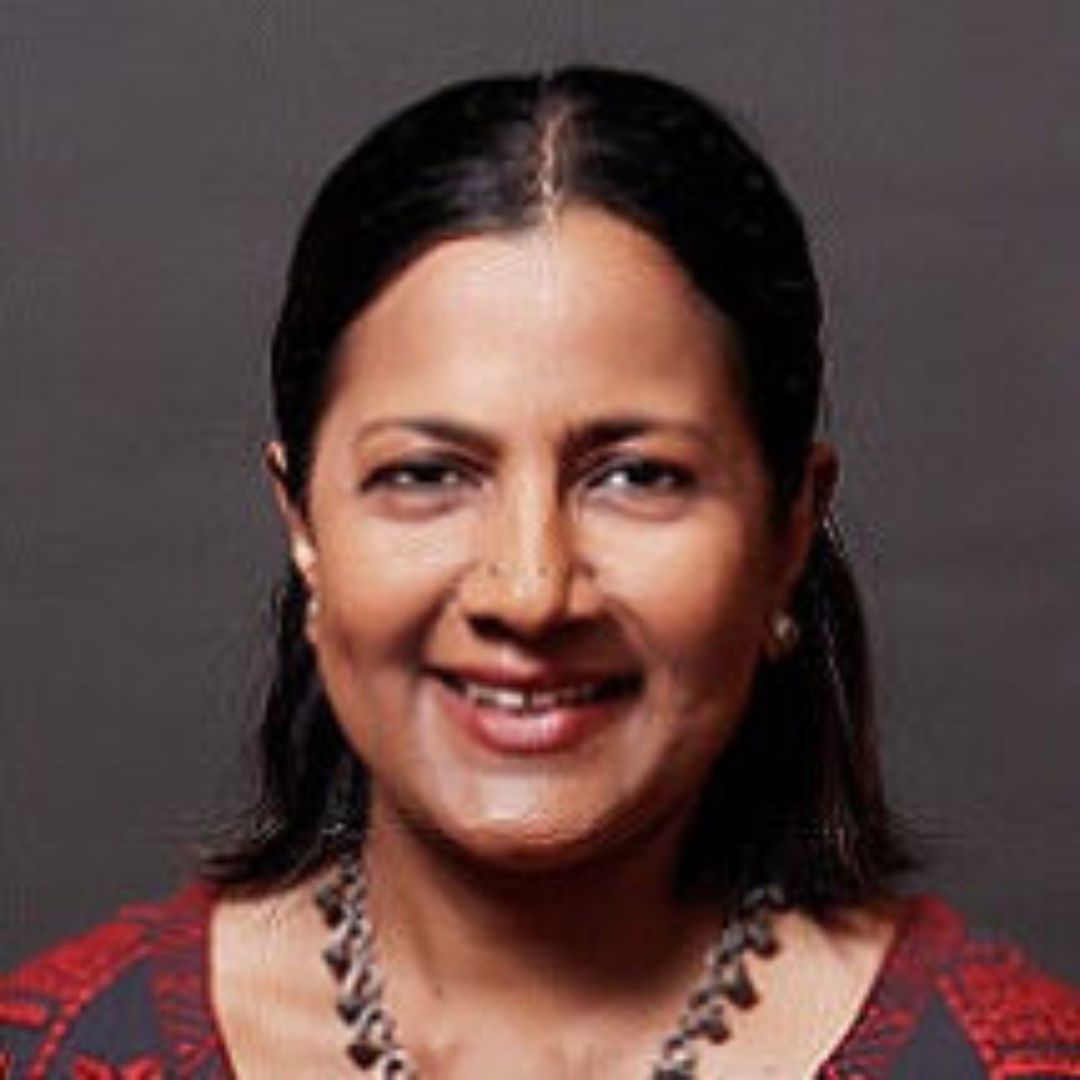 Headshot of Divya George-Wedge.