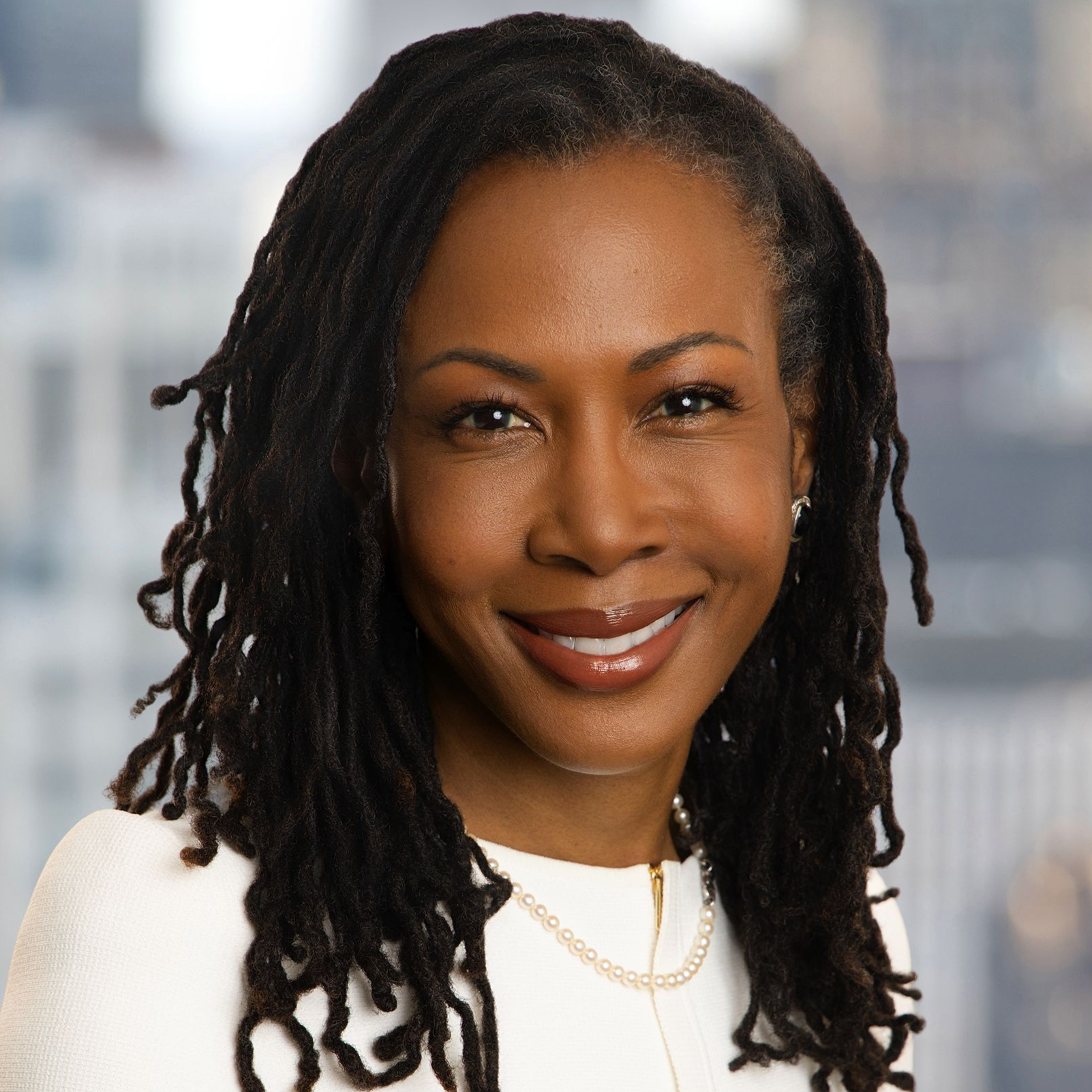 Headshot of Ghillaine Reid. 
